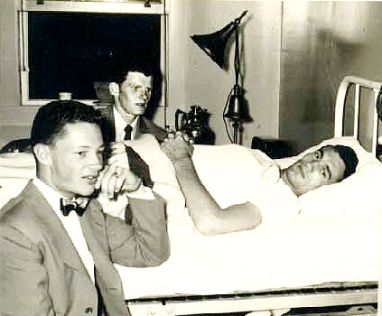 Don Howard and myself visiting LTjg Clayton in bed with broken back.