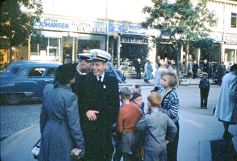 Trondheim: British lady gives Jess Taft advice while other officer (Jack Pickens?) passes out candy.